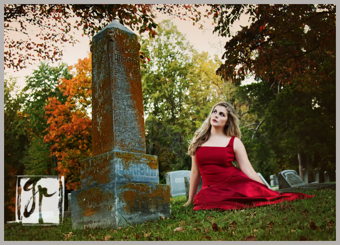 High School Senior in a Cemetery wearing a Red Dress