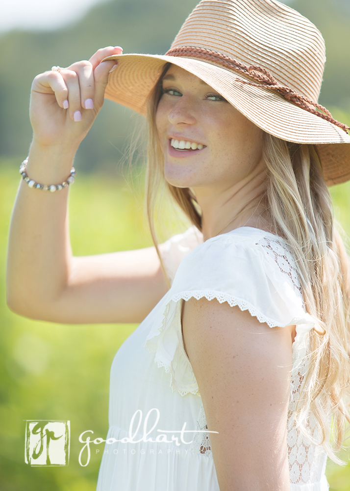 senior girl with a hat