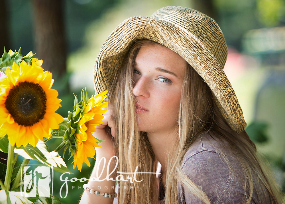 senior girl with bouquet of sunflowers